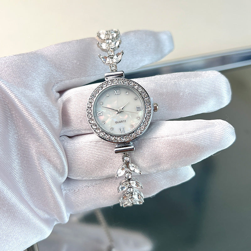 Affordable luxury quartz watch with diamond trim and free adjustable bracelet