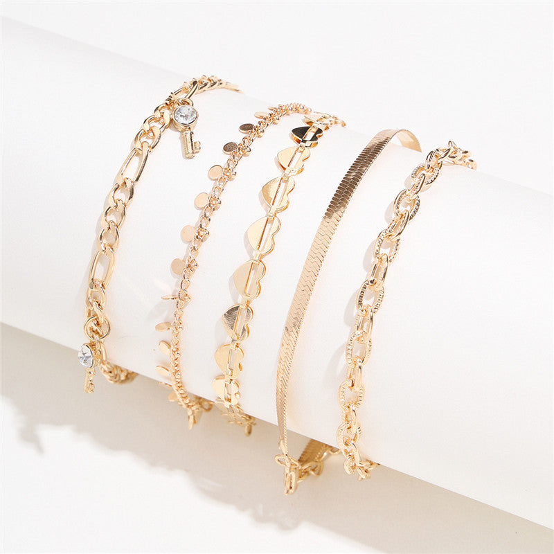 5er Set Goldene Fußketten mit Herz & Schlüssel – Trendige Damen Anklets im eleganten Design