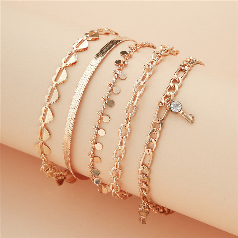 5er Set Goldene Fußketten mit Herz & Schlüssel – Trendige Damen Anklets im eleganten Design