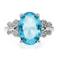 Elegant Ladies' Ring with Large Blue Zircon & Bow Design