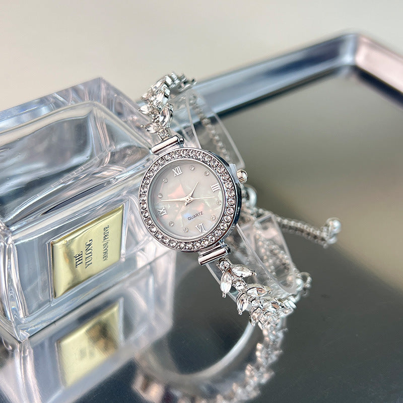 Affordable luxury quartz watch with diamond trim and free adjustable bracelet
