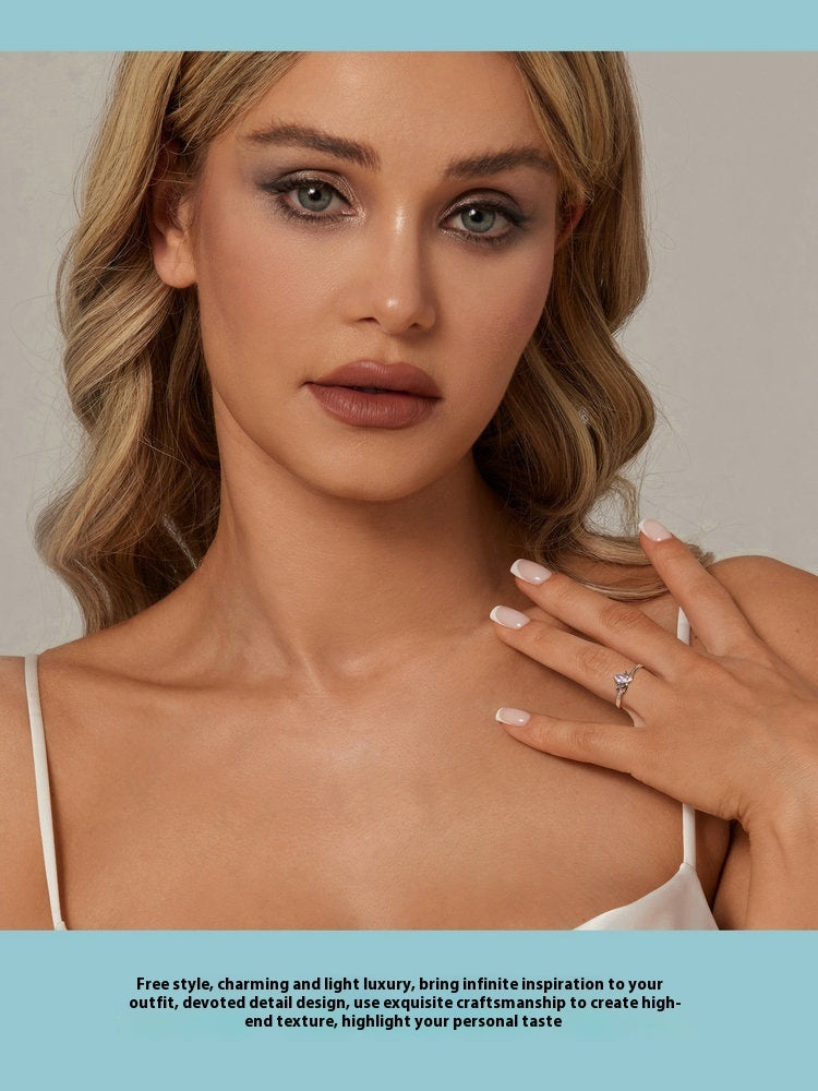 Originaler offener Lotusring mit lila Zirkonia