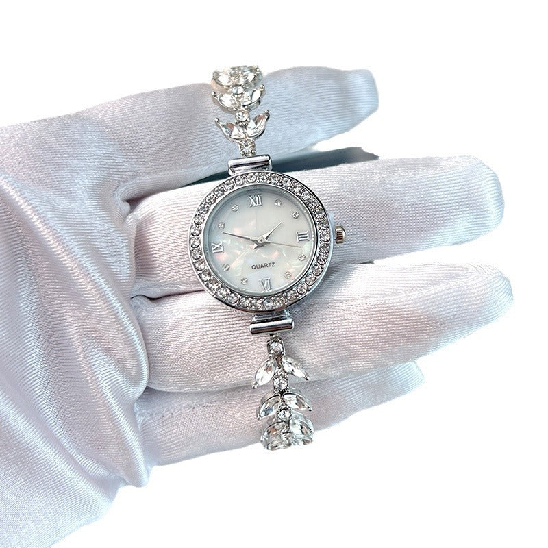 Affordable luxury quartz watch with diamond trim and free adjustable bracelet
